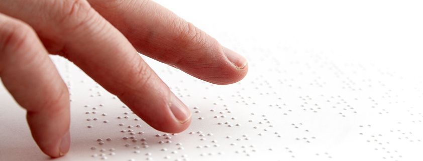 Fingertips touching braille indicates branding for Mission for Visually Impaired